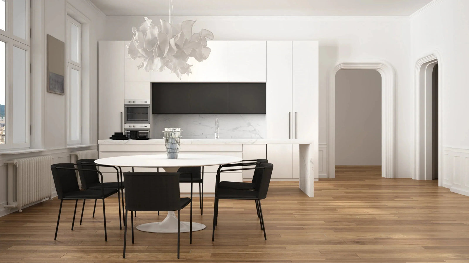 Sleek modern kitchen with white cabinets and warm-toned vinyl plank flooring.